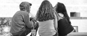 teenagers sitting in a circle discussing