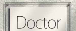 glass sign that says "Doctor"