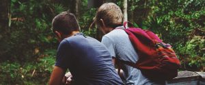 two teenage friends sitting together