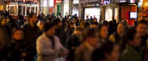 people walking down a shopping street