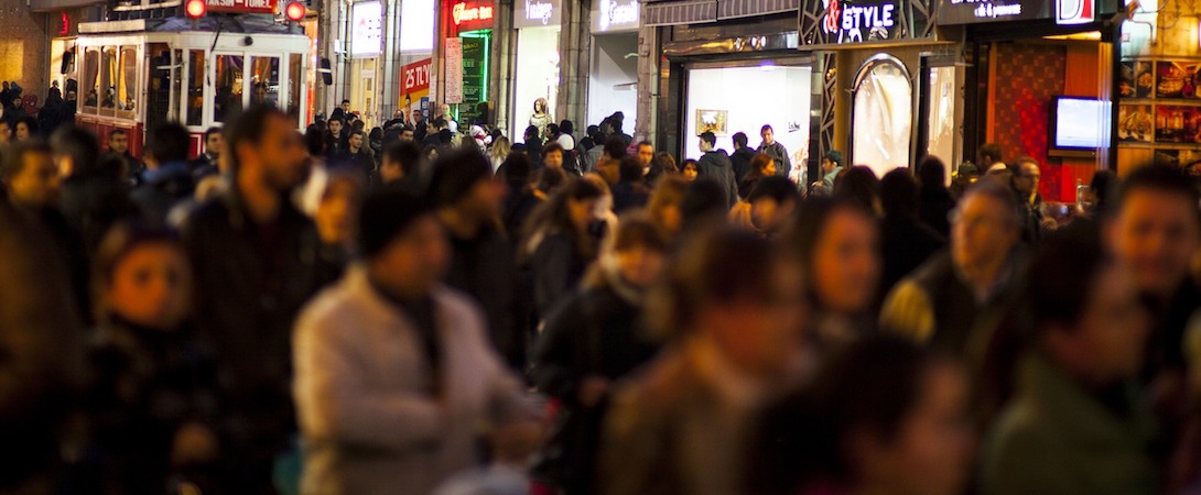 people walking down a shopping street