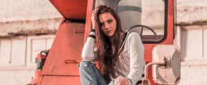 a woman sitting on a tractor