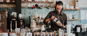a barista making coffee