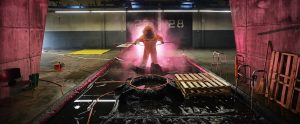 a man in a hazmat suit in an underground passage
