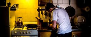 a man cooking in his kitchen