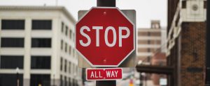 a red pedestrian sign that says "stop"