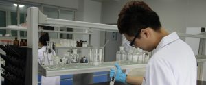 scientists in lab coats doing experiments