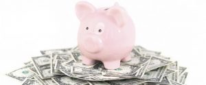 piggy bank on a pile of money