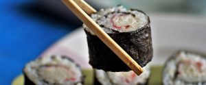 eating sushi with chopsticks