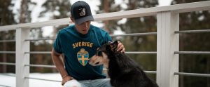 a Swedish man petting a dog