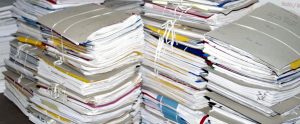 piles of paper stack on one another