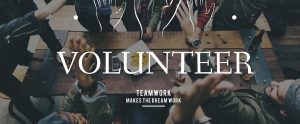 the word "VOLUNTEER" with a backdrop of people giving each other high fives