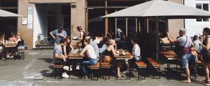 people sitting outside a restaurant