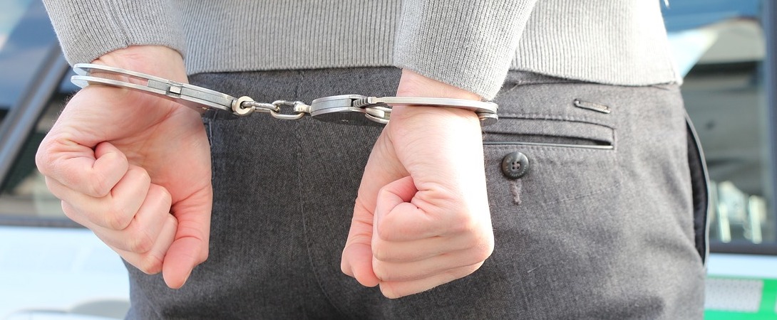 man's hands in handcuffs
