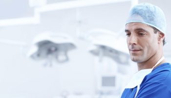 a doctor in blue scrub uniform