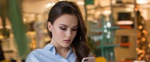woman looking at her phone