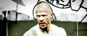 well trained abusive man with tattoos