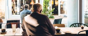 an old Japanese man in a cafe