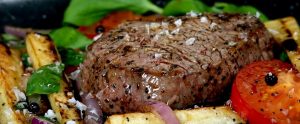 coocked steak and vegetables