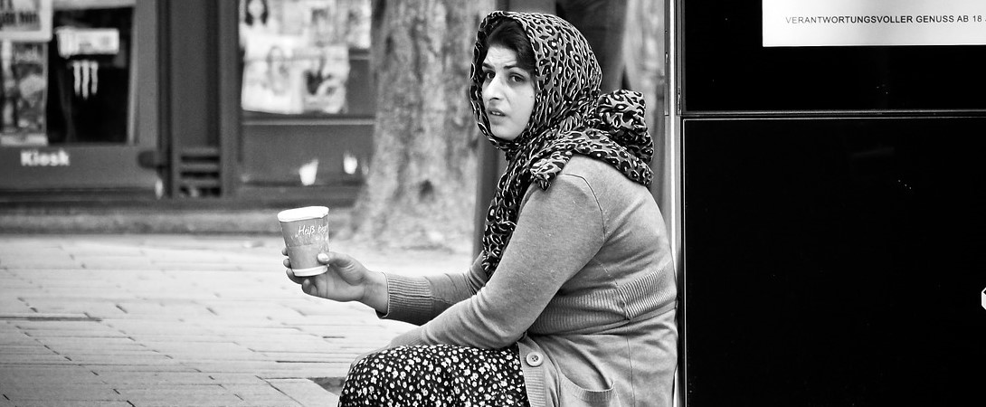 a homeless Gypsy beggar asking for money