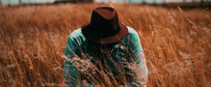 a farmer in a field of wheat