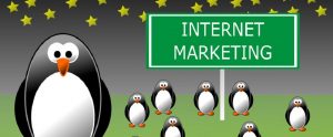 cartoon images of penguins with the sign "Internet Marketing"