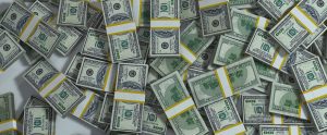 stacks of hundred dollar bills on the floor