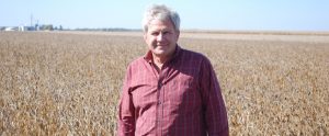 farmer in front of a wheat field