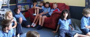 kids wearing school uniform in a classroom