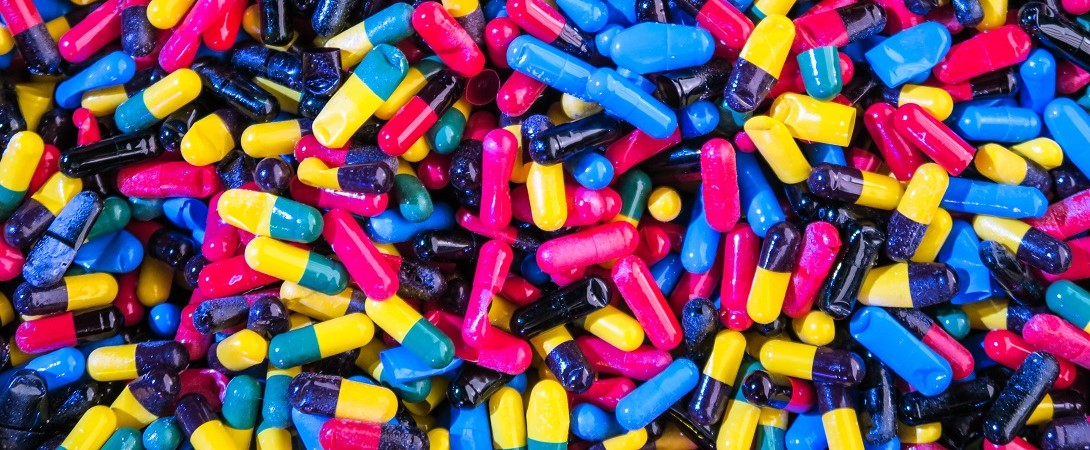 brightly coloured pills in a pile