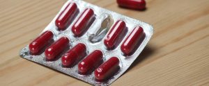 an opened packet of pills