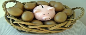 piggy bank in a basket of eggs