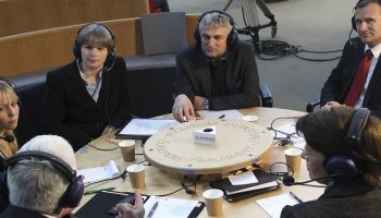 people sitting in a circle debating an important topic