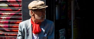elderly man standing in the street