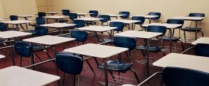 a classroom full of empty desks and chairs