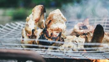poultry being cooked on a fire