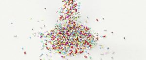 colorful pills cascading on the floor