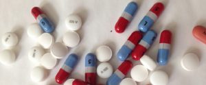 colourful pills sprawled on the floor