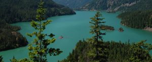 American lake with forests next to it