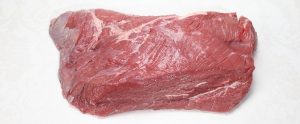 uncooked beef with a white background