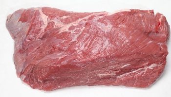 uncooked beef with a white background
