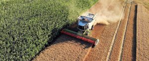 tractor harvesting farmland