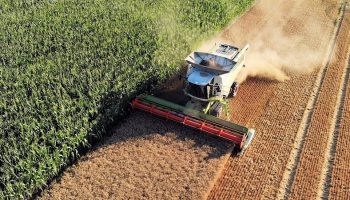 tractor harvesting farmland