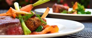 gourmet dishes of meat and vegetables