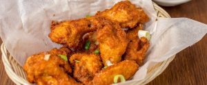 cooked chicken in a paper basket