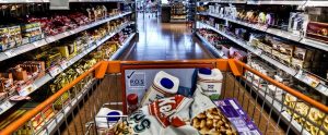 a full shopping cart in a shopping aisle