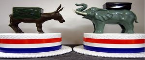 two cakes; one of the Democrat mascot and one of the Republican mascot