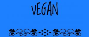 the word "vegan" in front of a blue background