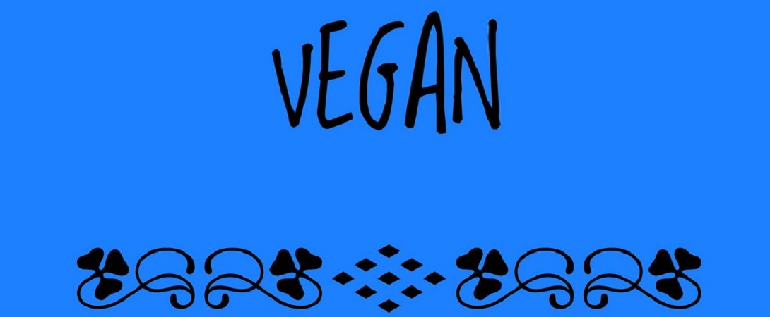 the word "vegan" in front of a blue background