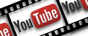cartoon YouTube logo on movie reel tape